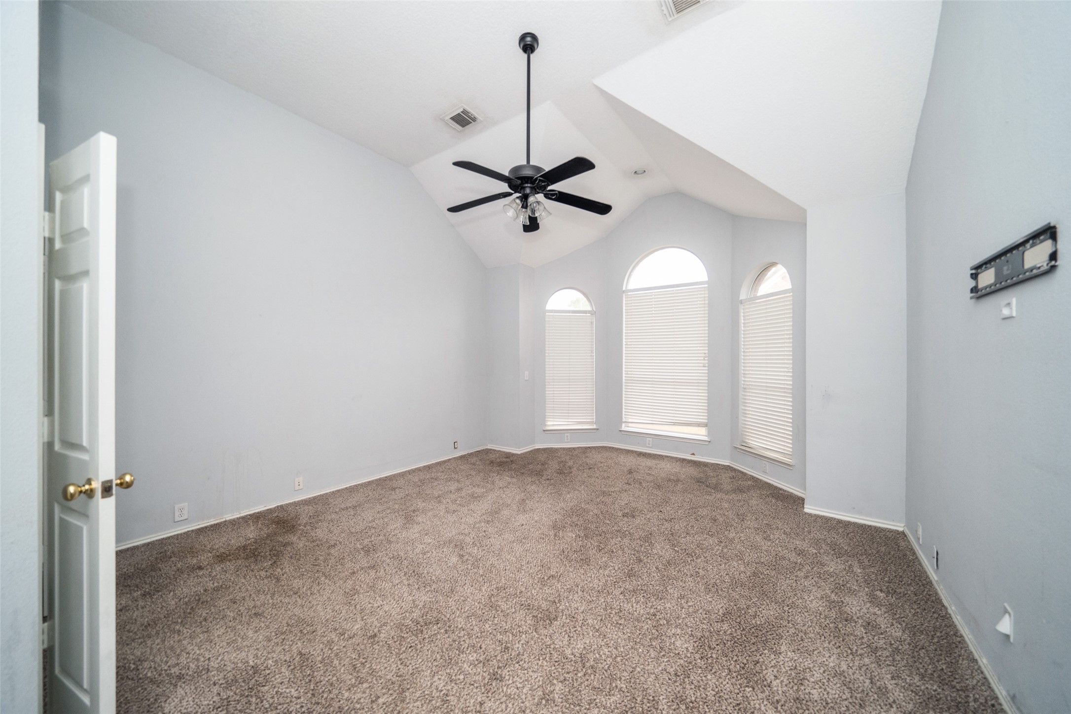 11534 Alpena Lane Houston, TX 77095 - Photo 19 of 28 an empty room with a ceiling fan and a window
