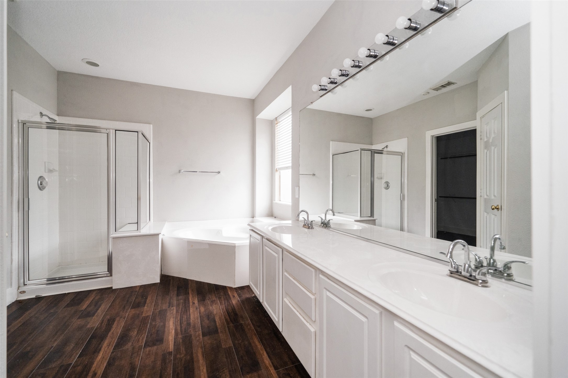 11534 Alpena Lane Houston, TX 77095 - Photo 20 of 28 a bathroom with a double vanity sink and mirror