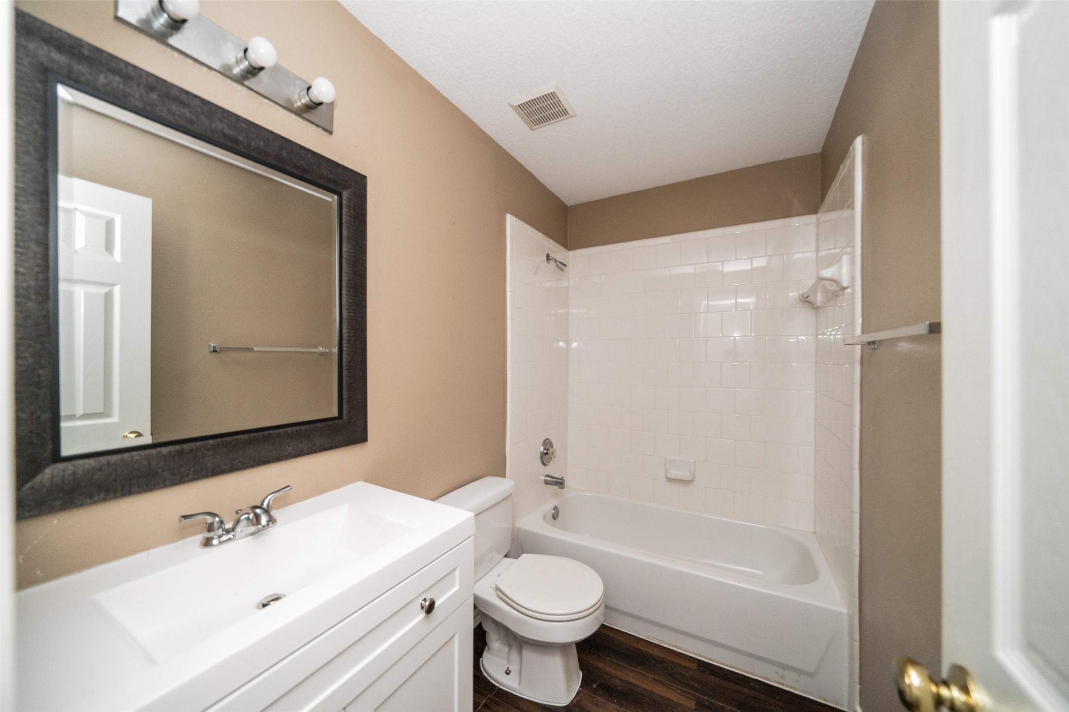 11534 Alpena Lane Houston, TX 77095 - Photo 24 of 28 a bathroom with a bathtub shower sink vanity mirror and toilet