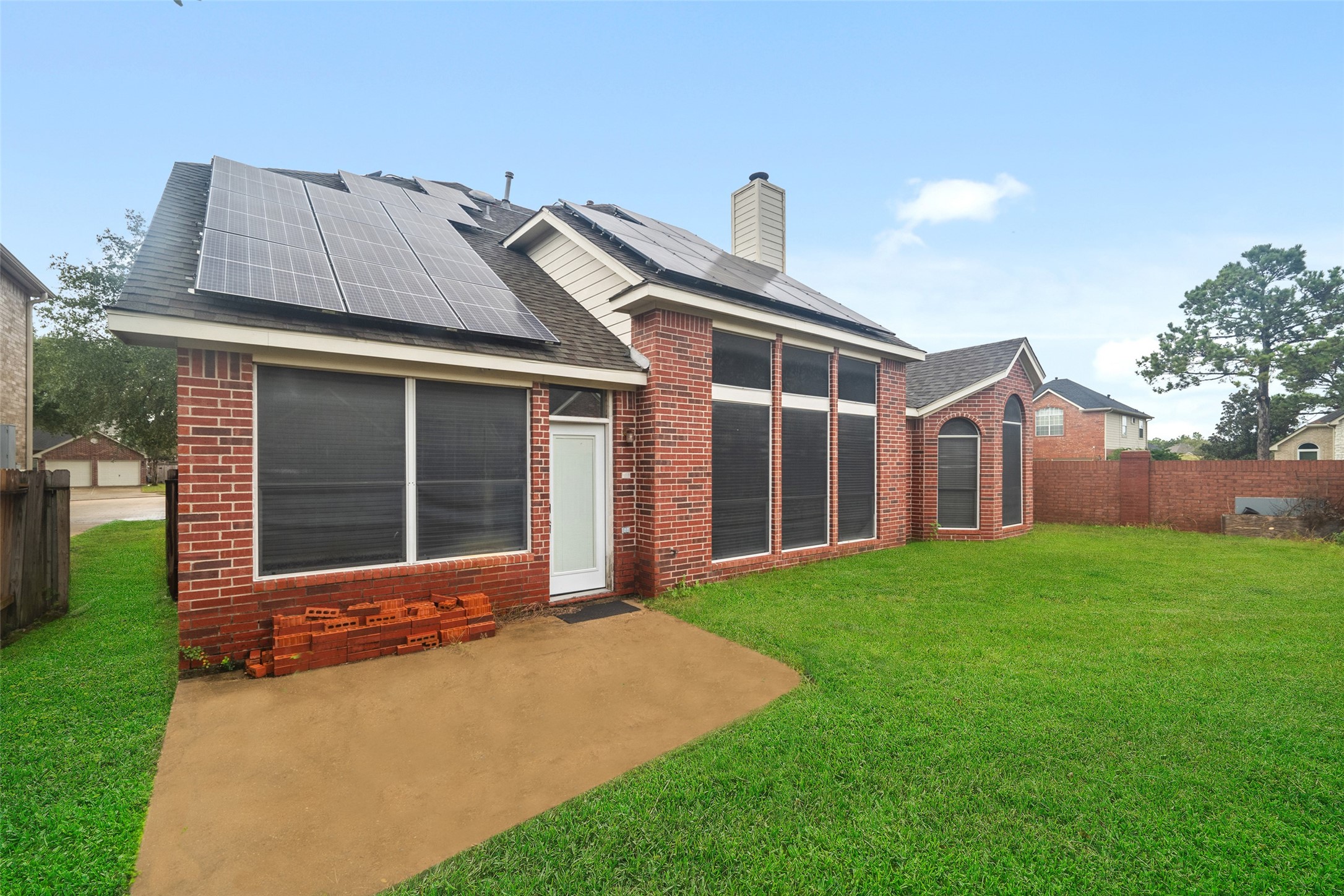 11534 Alpena Lane Houston, TX 77095 - Photo 26 of 28 a front view of a house with a garden and yard