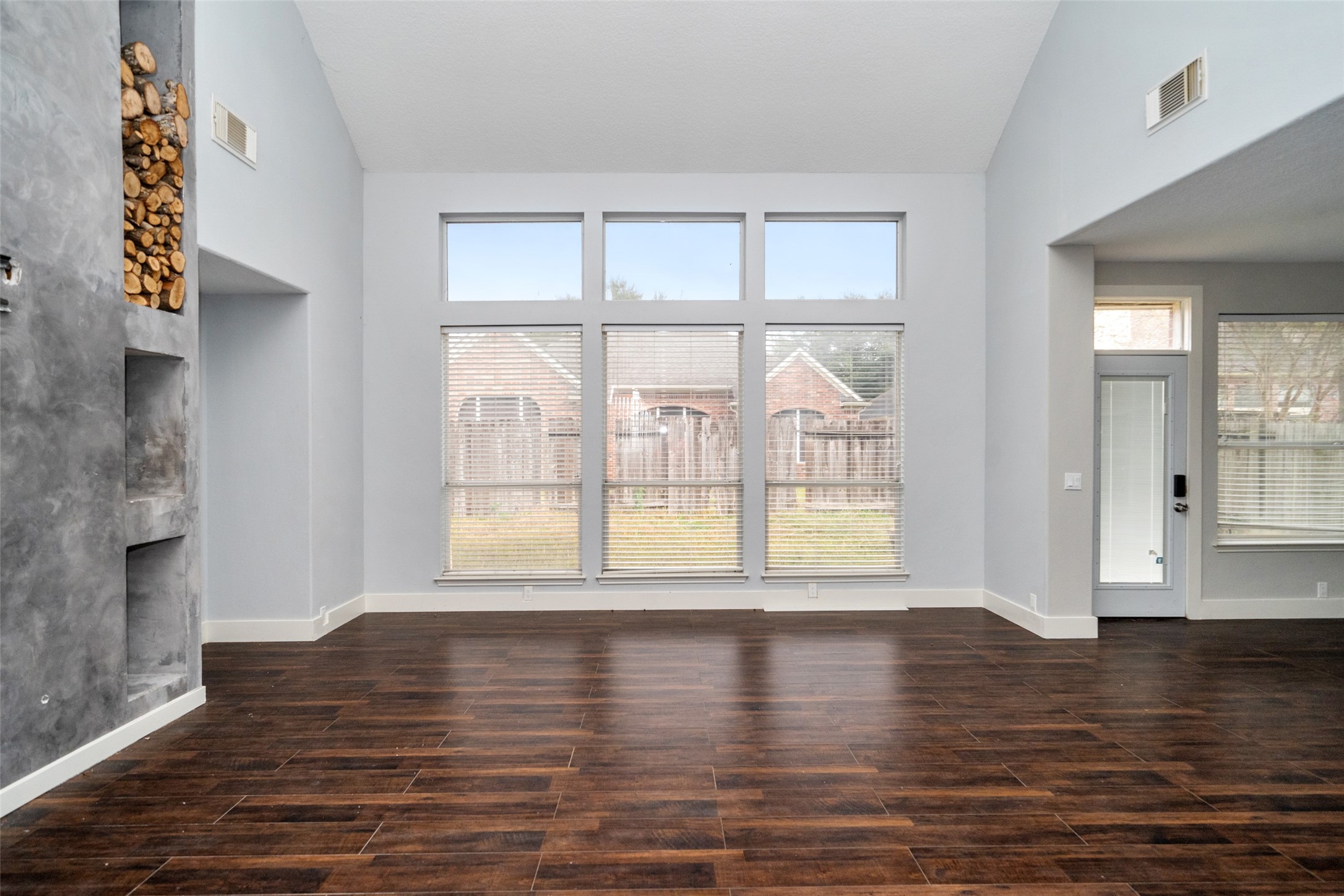 11534 Alpena Lane Houston, TX 77095 - Photo 5 of 28 a view of an empty room with wooden floor and a window