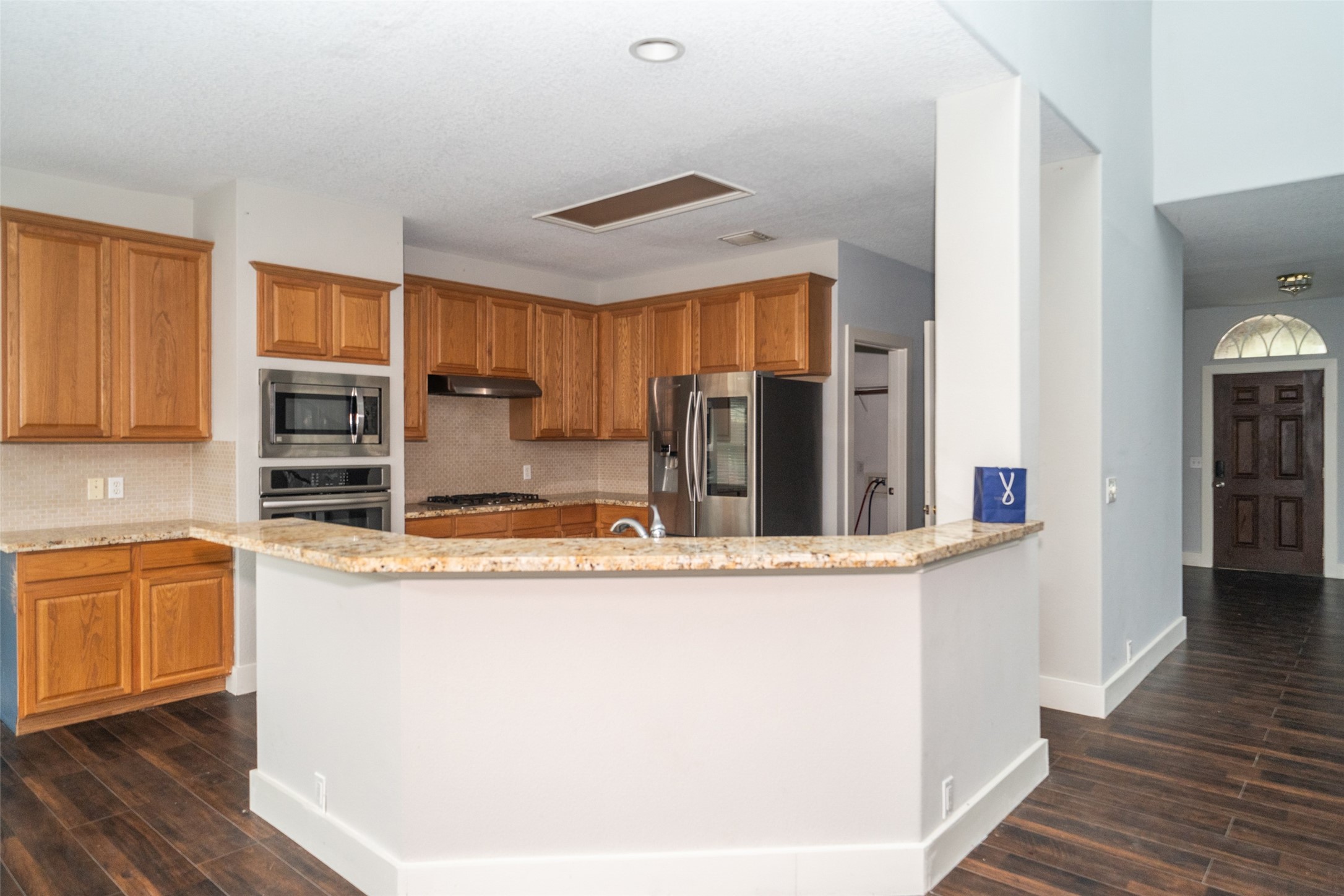 11534 Alpena Lane Houston, TX 77095 - Photo 6 of 28 a kitchen with stainless steel appliances granite countertop a sink and cabinets