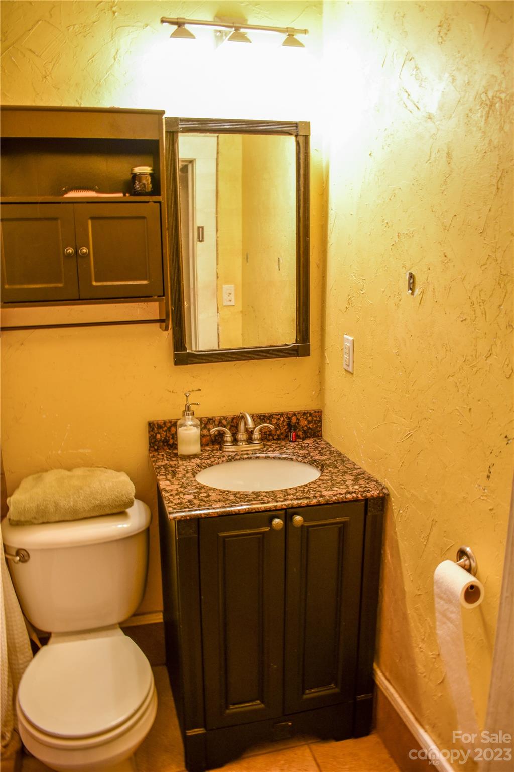 505 North Main Street Lenoir, NC 28645 - Photo 11 of 22 a bathroom with a granite countertop toilet and sink