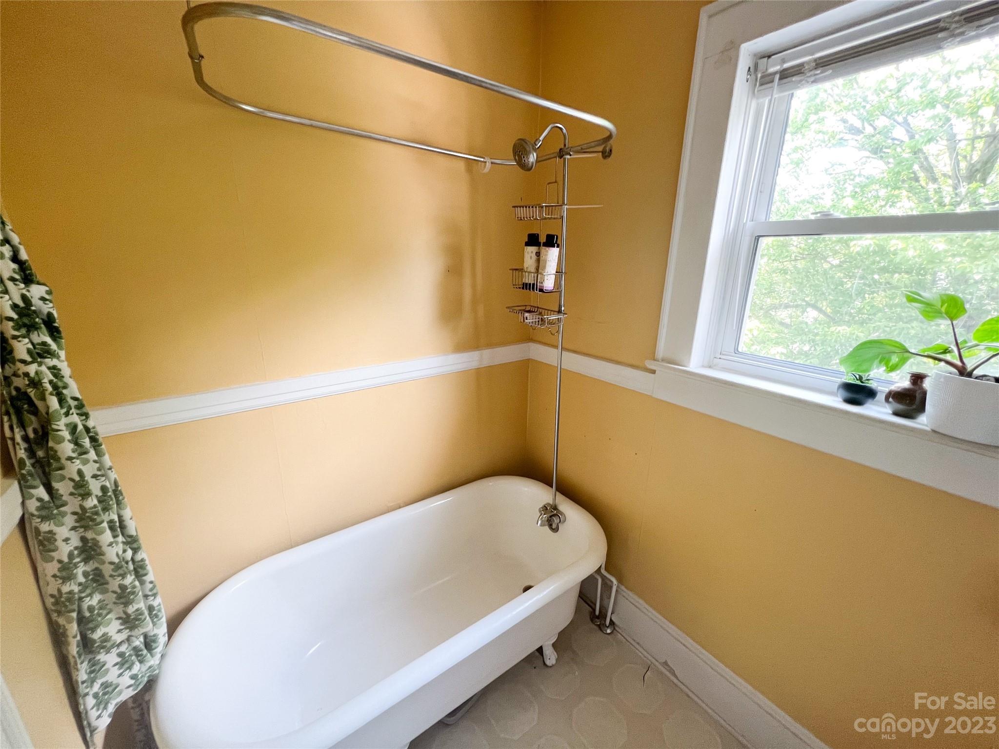 505 North Main Street Lenoir, NC 28645 - Photo 16 of 22 a bathroom with a tub and shower