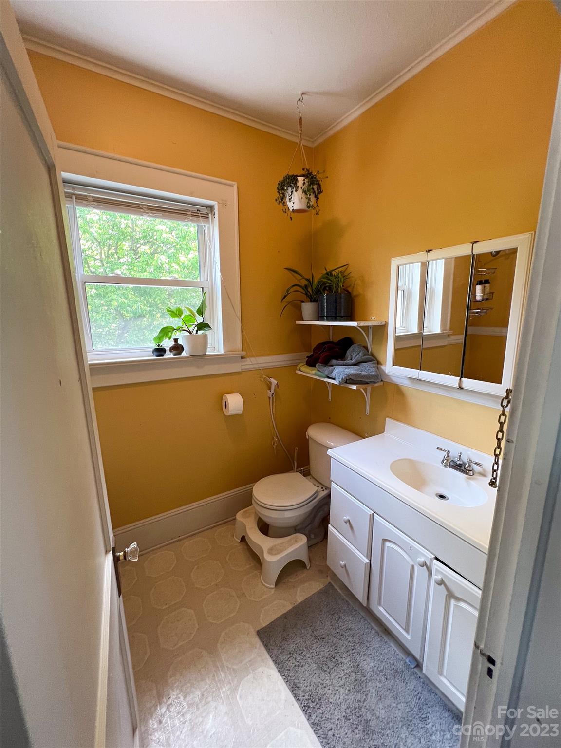 505 North Main Street Lenoir, NC 28645 - Photo 17 of 22 a bathroom with a granite countertop toilet sink and mirror