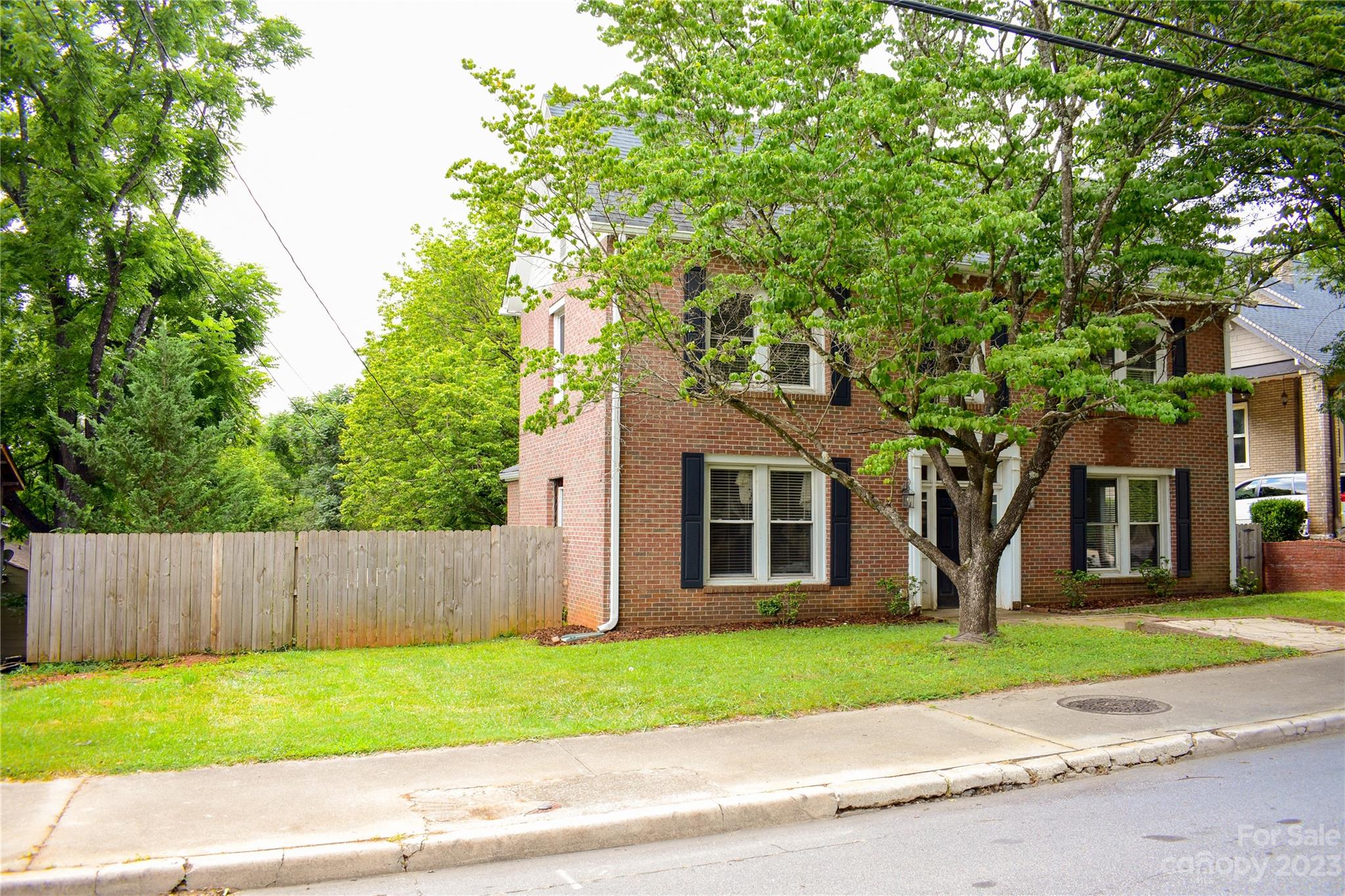 505 North Main Street Lenoir, NC 28645 - Photo 2 of 22 a house with a tree in front of it