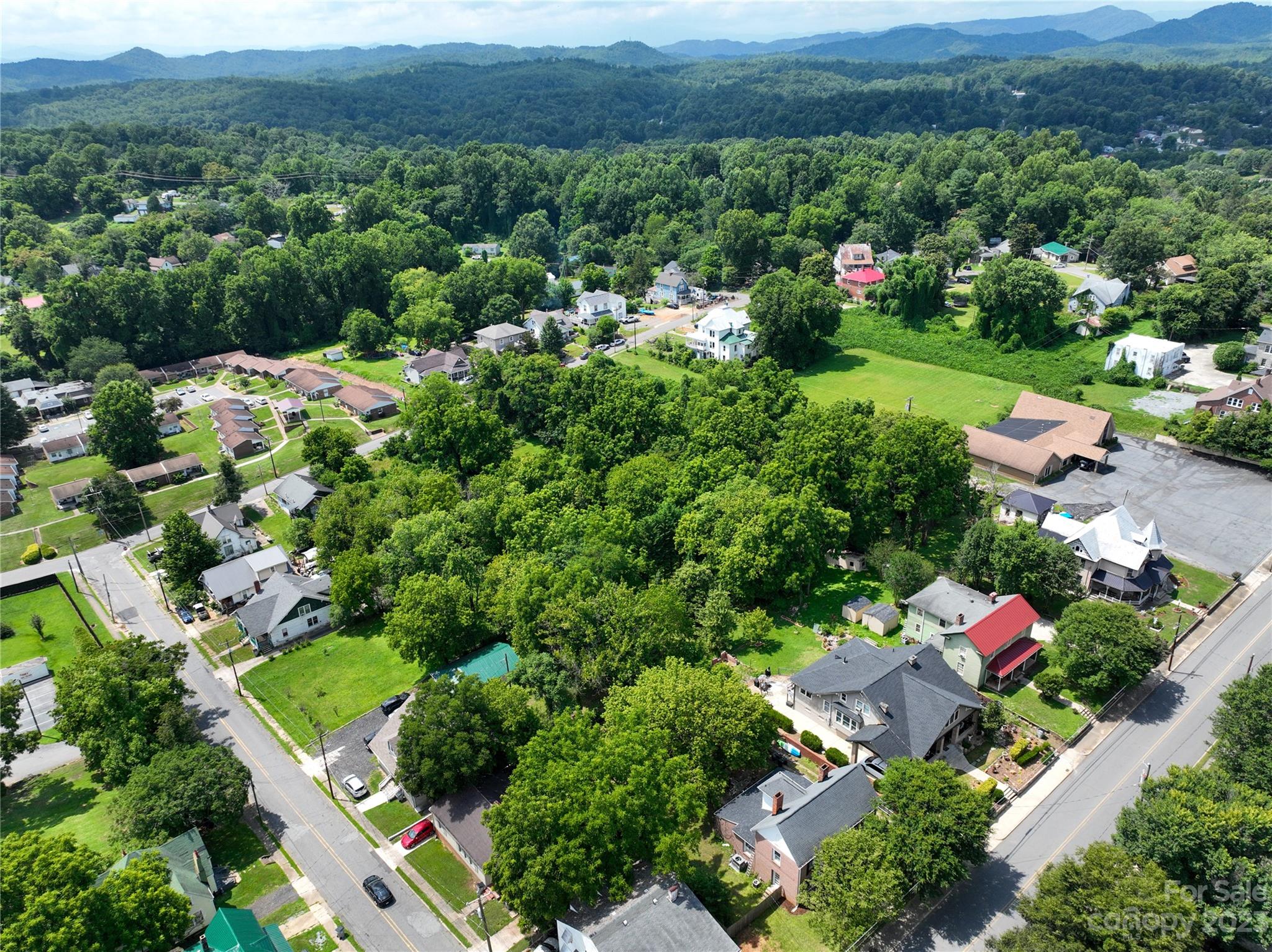 505 North Main Street Lenoir, NC 28645 - Photo 21 of 22 an aerial view of a houses with a yard and lake