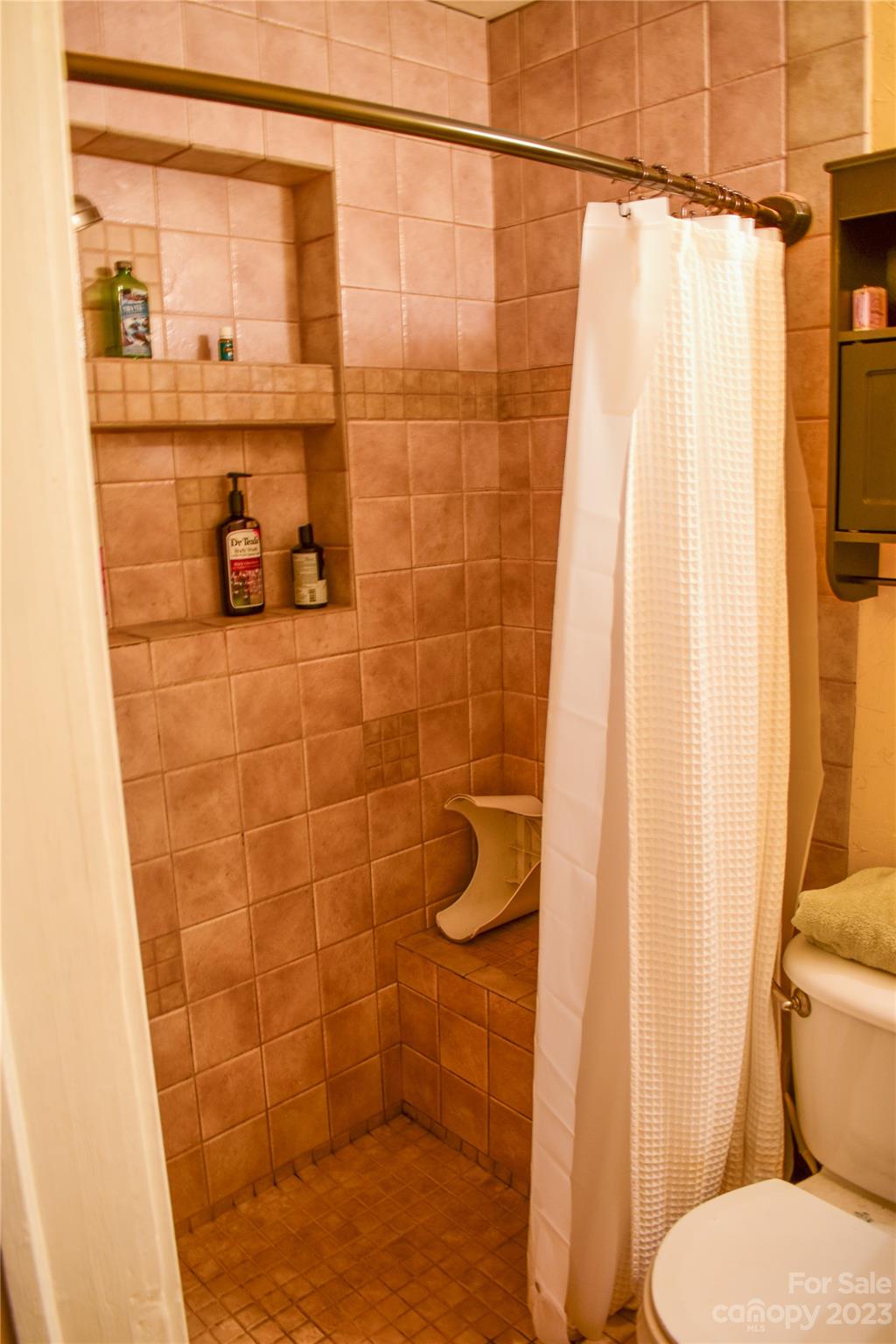 505 North Main Street Lenoir, NC 28645 - Photo 10 of 22 a bathroom with a toilet and shower