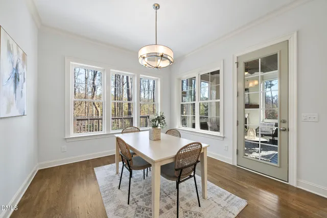 a spacious bathroom with a double vanity sink a mirror and a shower
