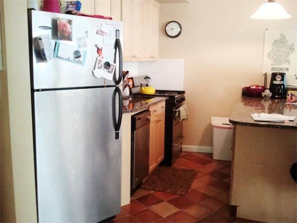 516 Green Street, Unit 1D Cambridge, MA 02139 - Photo 5 of 13 a utility room with cabinets washer and dryer