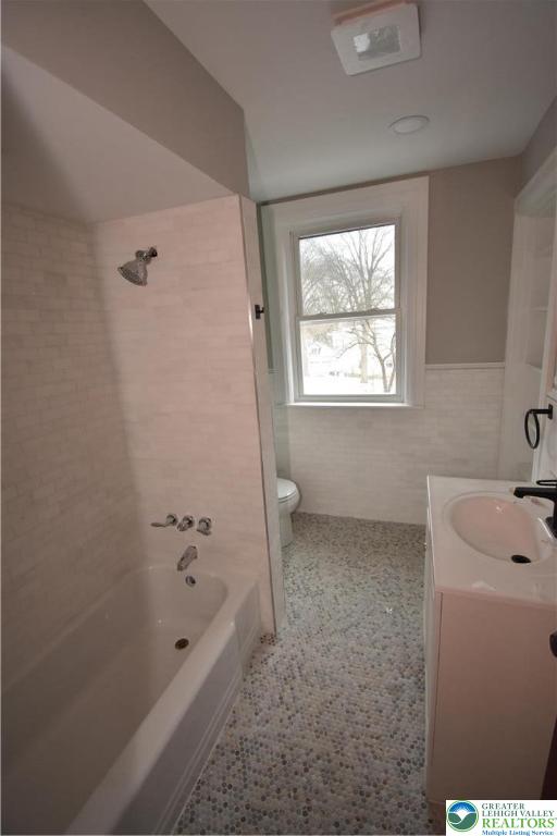 312 March Street, Unit 4 Easton, PA 18042 - Photo 6 of 8 a bathroom with a tub sink and window