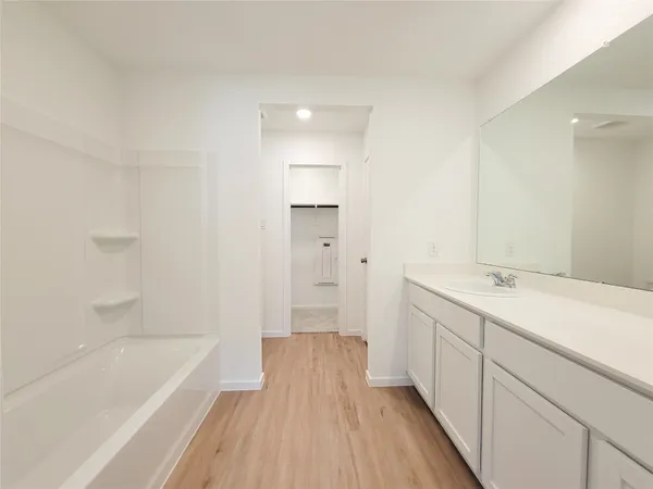 a bathroom with a sink a bathtub and a shower