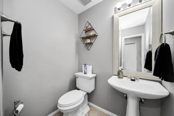 a bedroom with a bed and a table