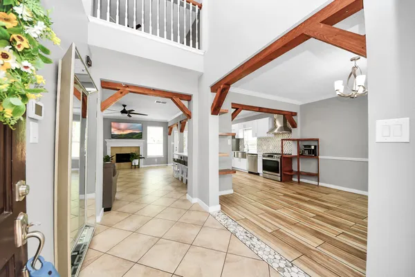 a large kitchen with stainless steel appliances granite countertop a lot of counter space a sink and a stove