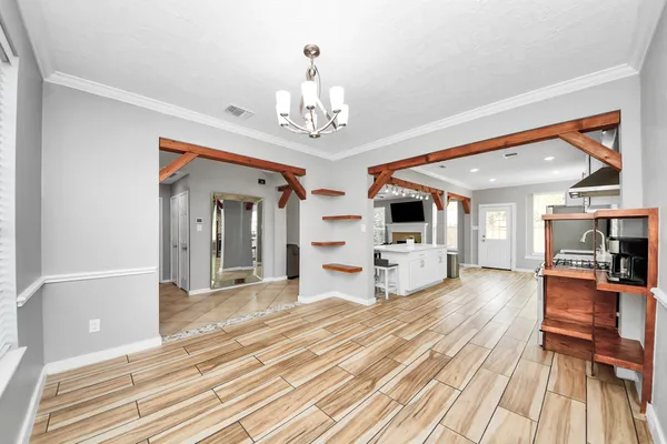a kitchen with stainless steel appliances a refrigerator and a stove top oven