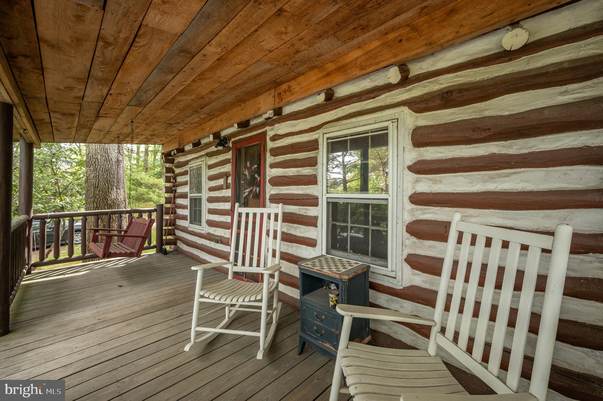 560 Glendale Road Oakland, MD 21550 - Photo 2 of 24 a view of a chairs on the deck