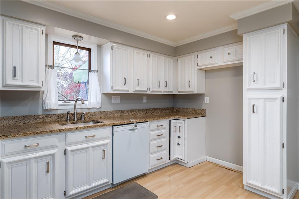1512 Bower Hill Road Pittsburgh, PA 15243 - Photo 8 of 25 a kitchen with granite countertop white cabinets white appliances and a sink