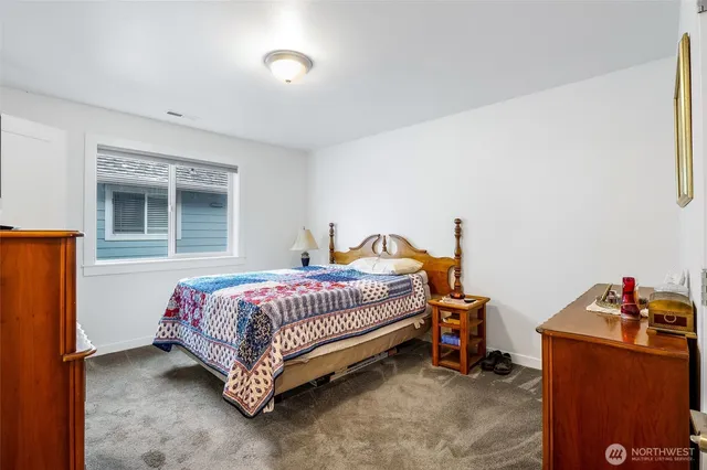 a bedroom with bed and a window