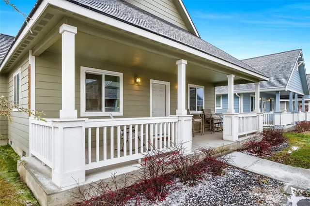 a view of a house with porch and sitting area