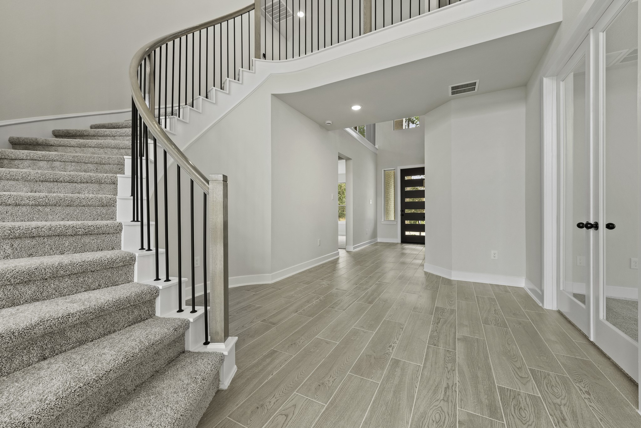 710 Walnut Br Drive Rosenberg, TX 77471 - Photo 15 of 24 a view of a hallway with wooden floor and entryway