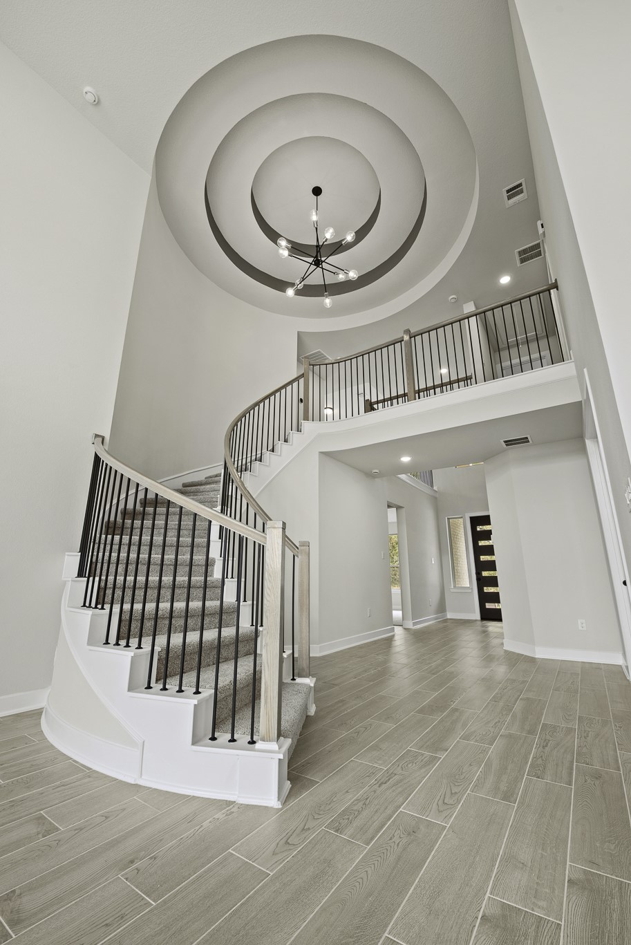 710 Walnut Br Drive Rosenberg, TX 77471 - Photo 2 of 24 a view of a hallway with entryway and wooden floor