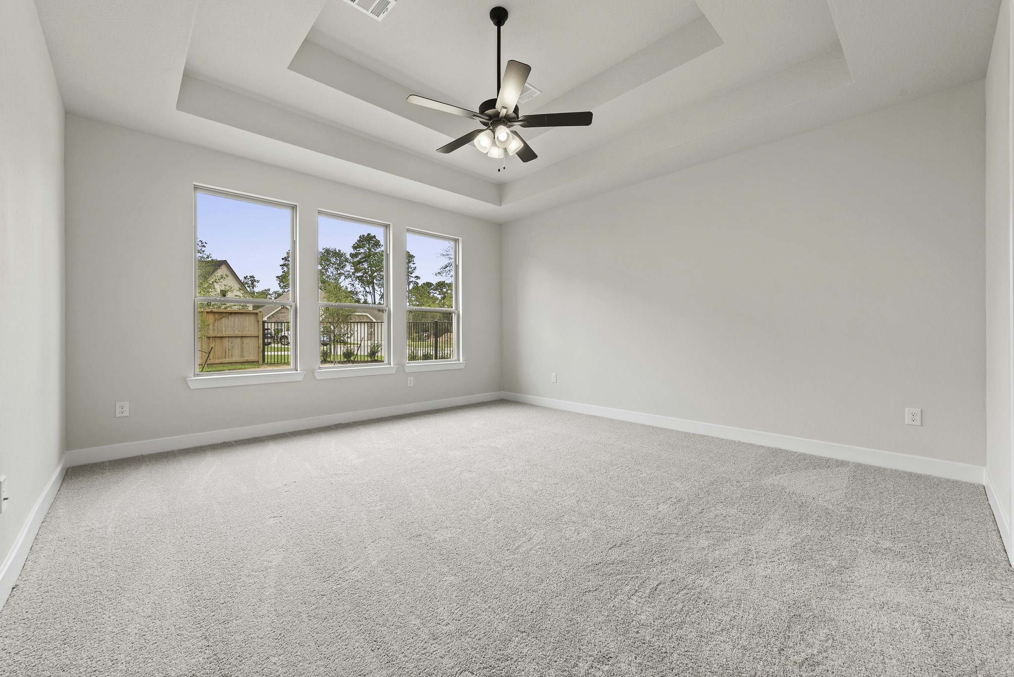 710 Walnut Br Drive Rosenberg, TX 77471 - Photo 7 of 24 an empty room with windows and chandelier fan