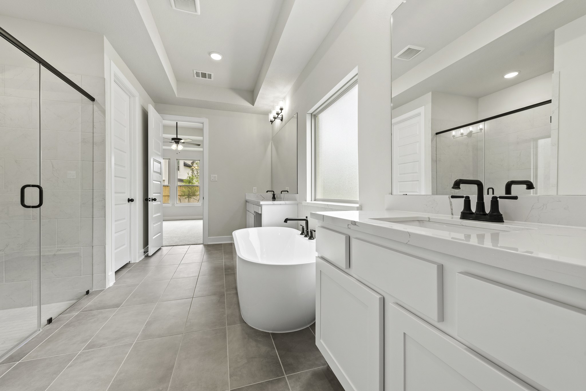 710 Walnut Br Drive Rosenberg, TX 77471 - Photo 9 of 24 a bathroom with a double vanity sink mirror and shower