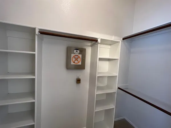 a view of an empty walk in closet