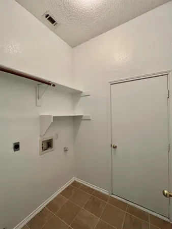 a view of a room with shelf on the wall