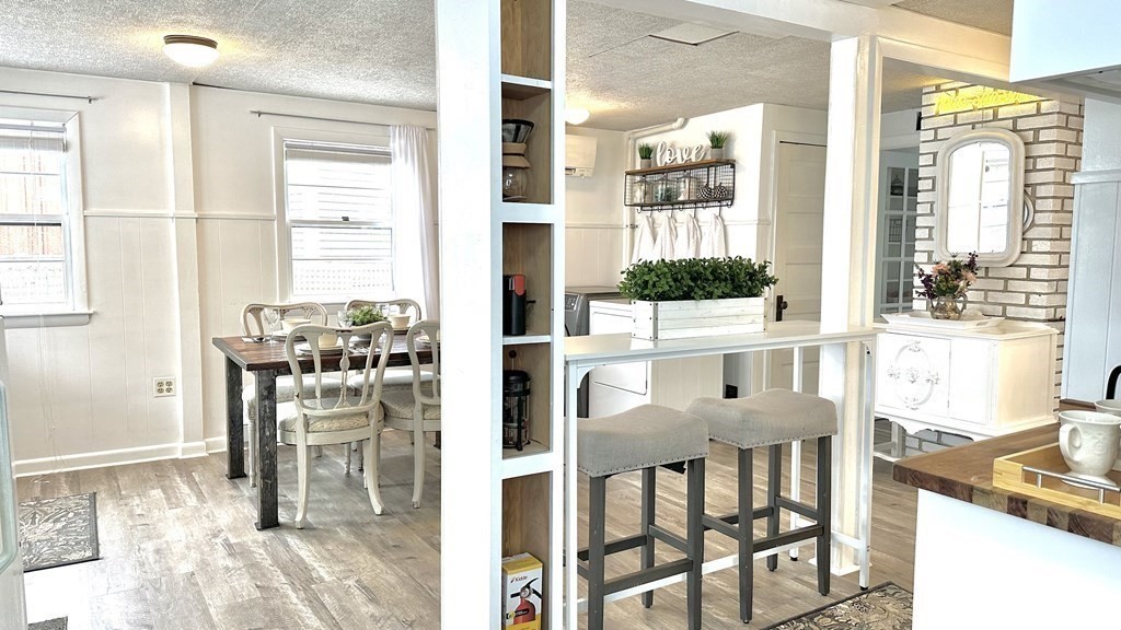 294 Killdeer Road Webster, MA 01570 - Photo 15 of 42 a view of a dining room with furniture and a window