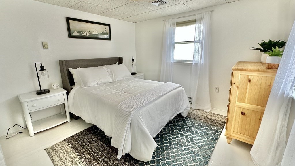 294 Killdeer Road Webster, MA 01570 - Photo 16 of 42 a bedroom with a bed and wooden floor