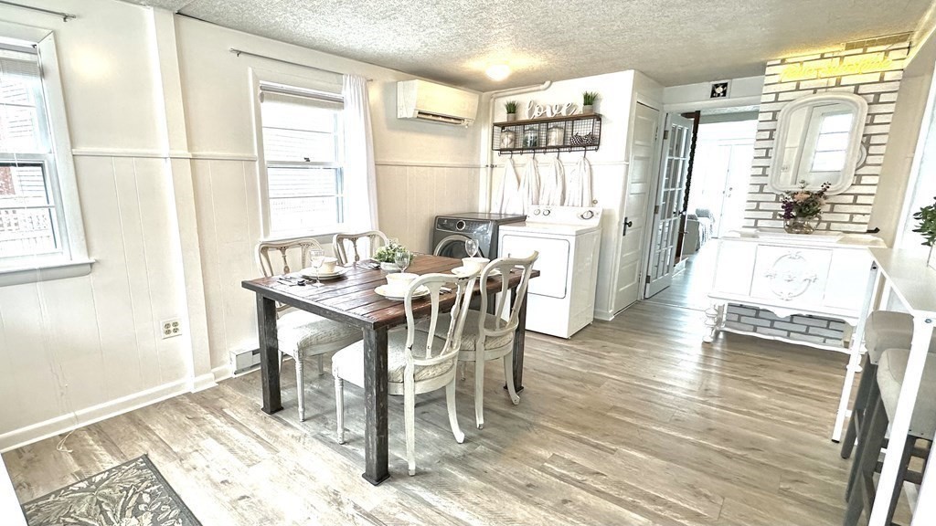 294 Killdeer Road Webster, MA 01570 - Photo 17 of 42 a view of a dining room with furniture and wooden floor