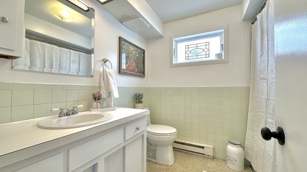 294 Killdeer Road Webster, MA 01570 - Photo 22 of 42 a bathroom with a sink toilet and a mirror