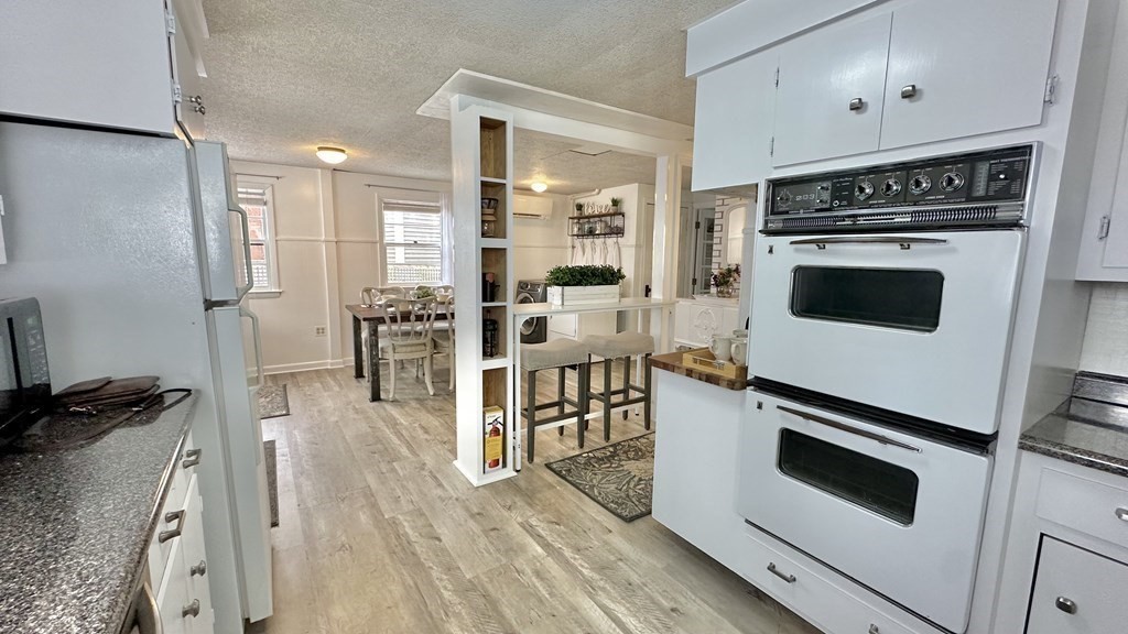 294 Killdeer Road Webster, MA 01570 - Photo 24 of 42 a kitchen with stainless steel appliances a stove a refrigerator and a wooden cabinets