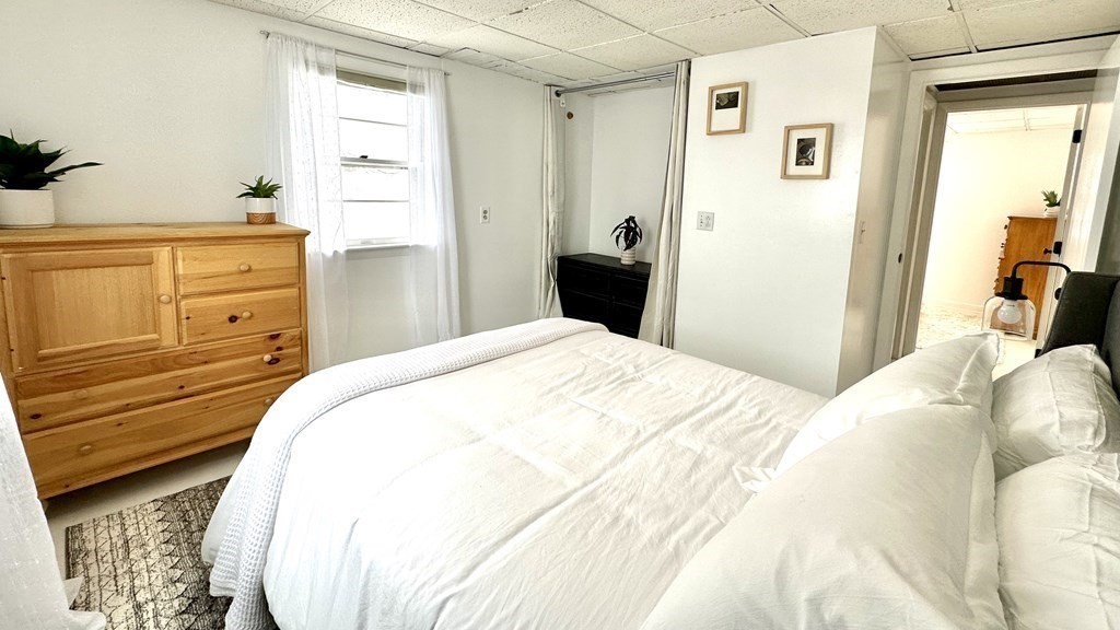 294 Killdeer Road Webster, MA 01570 - Photo 27 of 42 a bedroom with a bed and a dresser