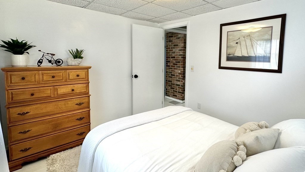 294 Killdeer Road Webster, MA 01570 - Photo 30 of 42 a bedroom with a bed and a dresser