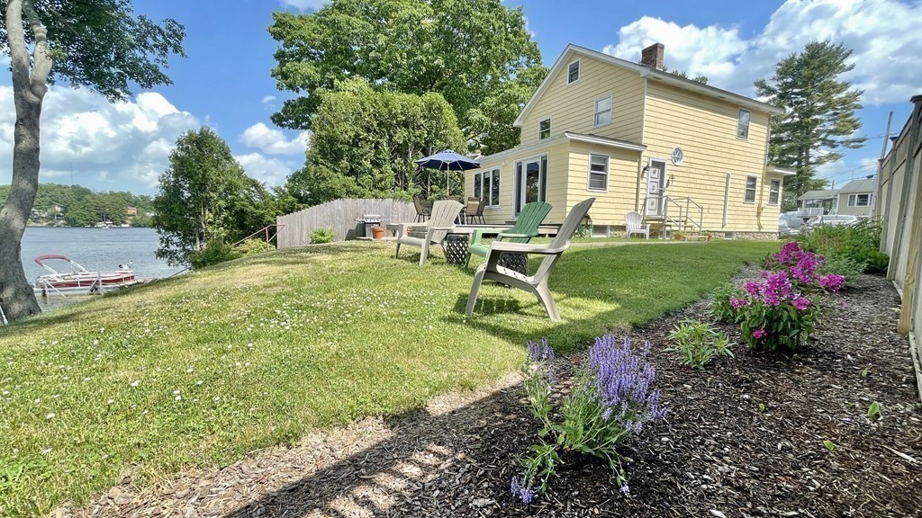 294 Killdeer Road Webster, MA 01570 - Photo 3 of 42 a front view of a house with garden