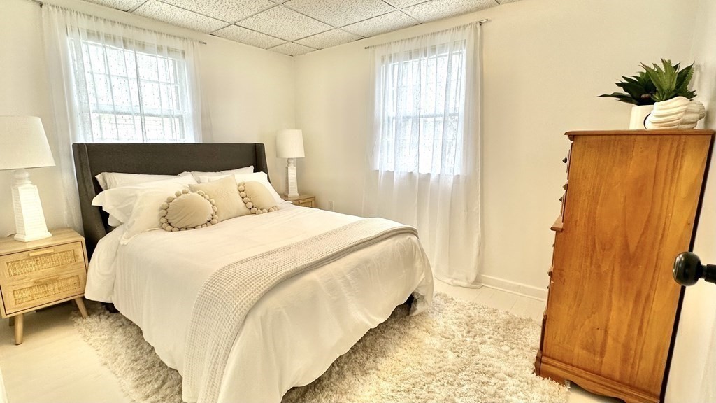 294 Killdeer Road Webster, MA 01570 - Photo 31 of 42 a bedroom with a bed and wooden floor