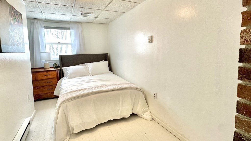 294 Killdeer Road Webster, MA 01570 - Photo 33 of 42 a bedroom with a bed and a window