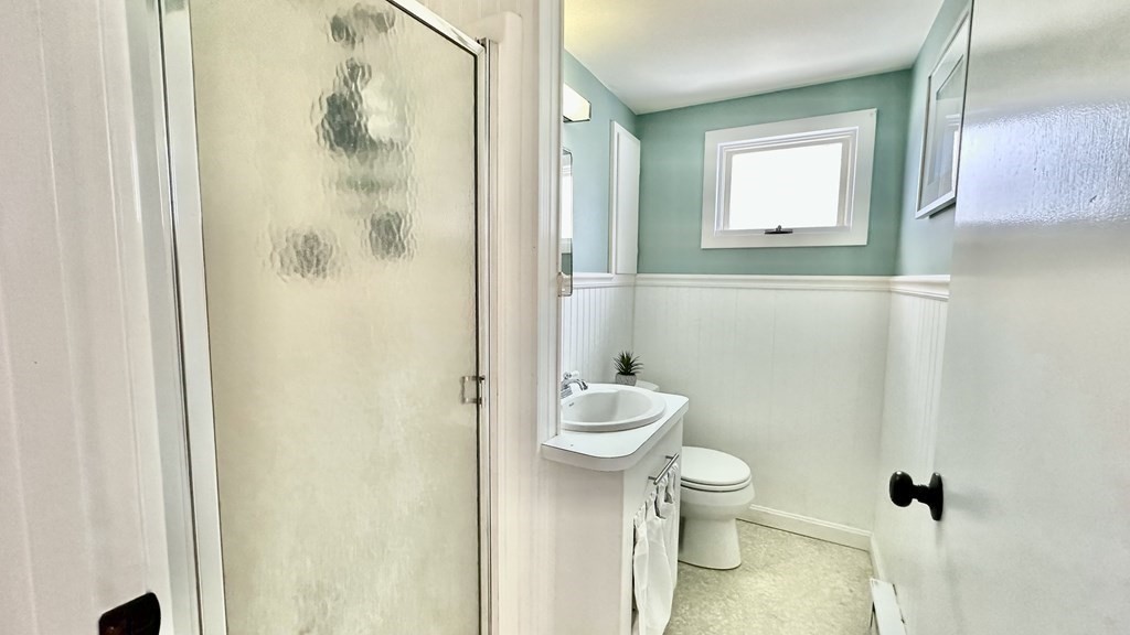 294 Killdeer Road Webster, MA 01570 - Photo 34 of 42 a bathroom with a toilet a sink and a mirror