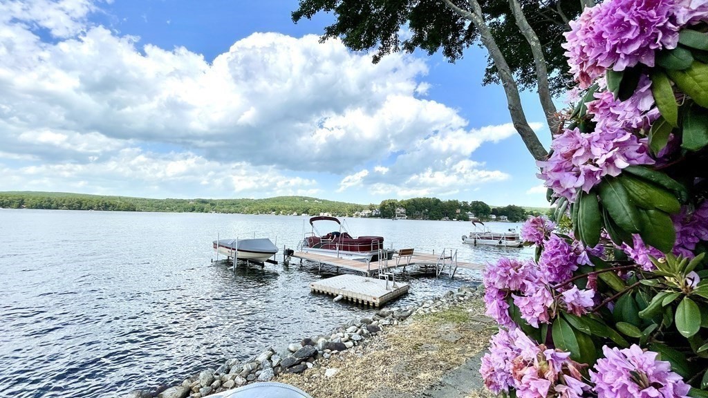 294 Killdeer Road Webster, MA 01570 - Photo 40 of 42 a view of a lake with a table and chairs