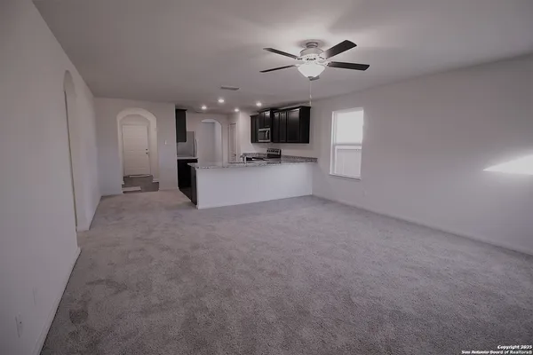 a view of a livingroom with a ceiling fan