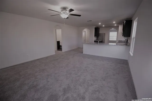 a view of an empty room with a cabinet