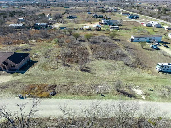 a aerial view of a house with a yard