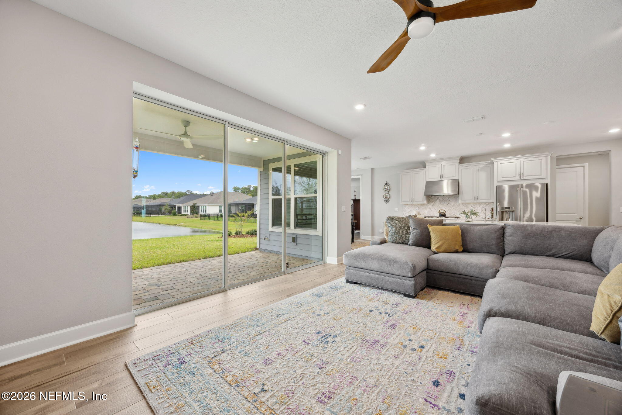 92503 Shipton Lane Fernandina Beach, FL 32034 - Photo 13 of 32 a living room with furniture and a floor to ceiling window