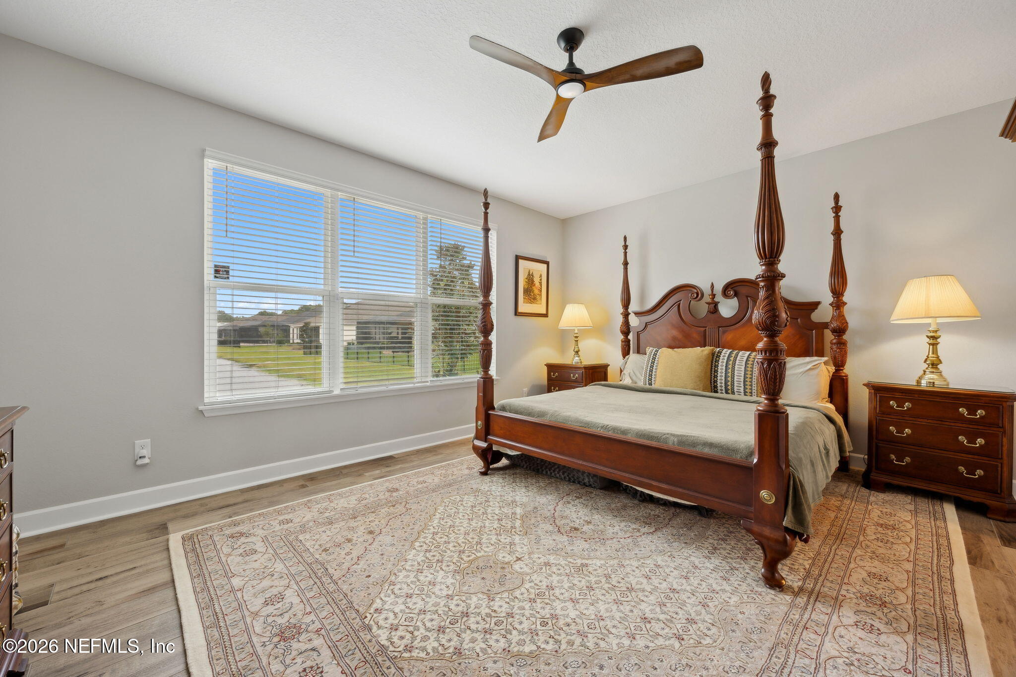 92503 Shipton Lane Fernandina Beach, FL 32034 - Photo 16 of 32 a bedroom with a bed dresser and a window