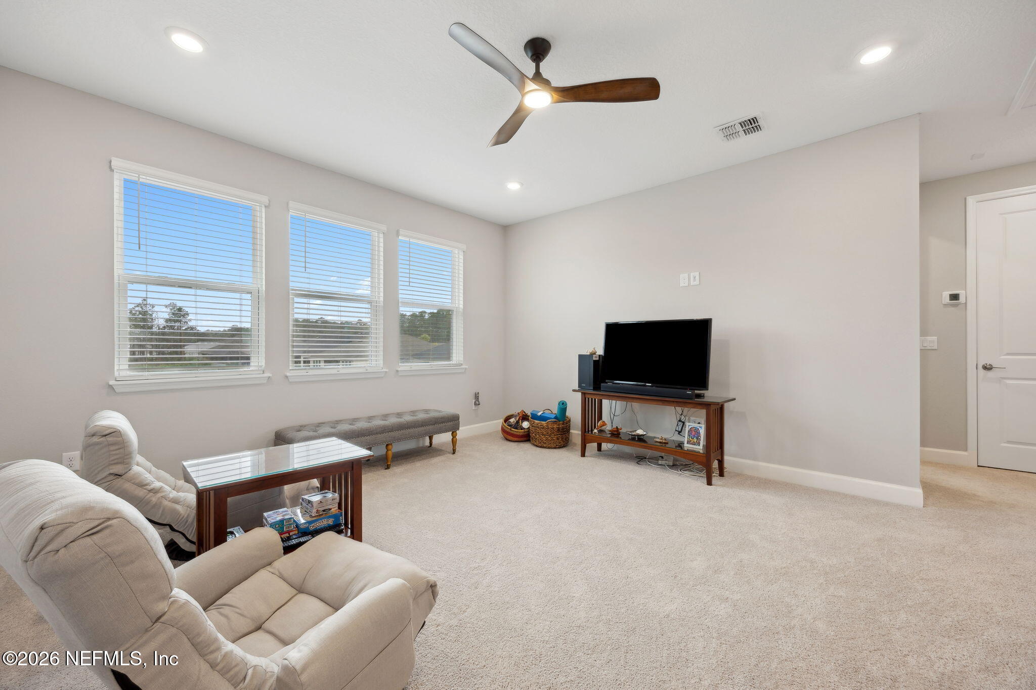 92503 Shipton Lane Fernandina Beach, FL 32034 - Photo 21 of 32 a living room with furniture and a flat screen tv