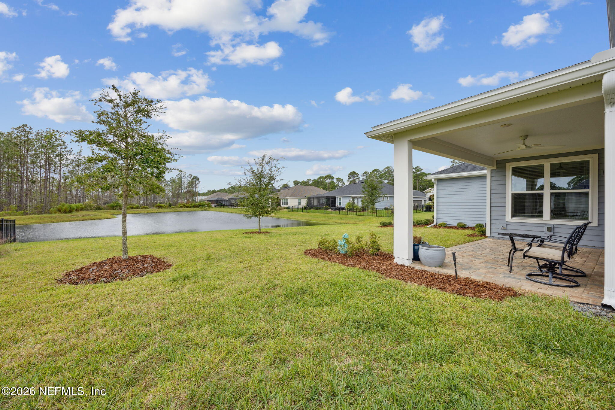 92503 Shipton Lane Fernandina Beach, FL 32034 - Photo 30 of 32 a swimming pool with some trees in the background