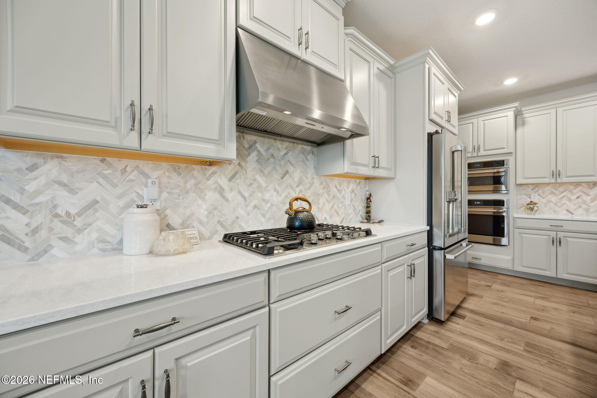 92503 Shipton Lane Fernandina Beach, FL 32034 - Photo 8 of 32 a kitchen with stainless steel appliances granite countertop a sink a stove and cabinets