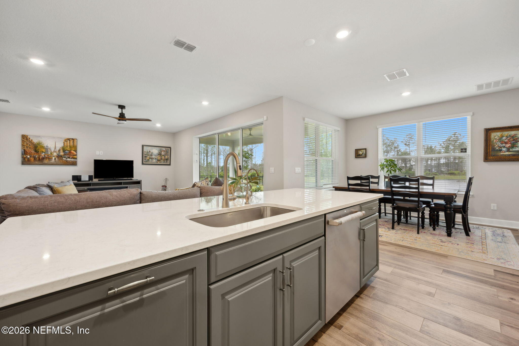 92503 Shipton Lane Fernandina Beach, FL 32034 - Photo 9 of 32 a kitchen with stainless steel appliances kitchen island granite countertop a sink and cabinets
